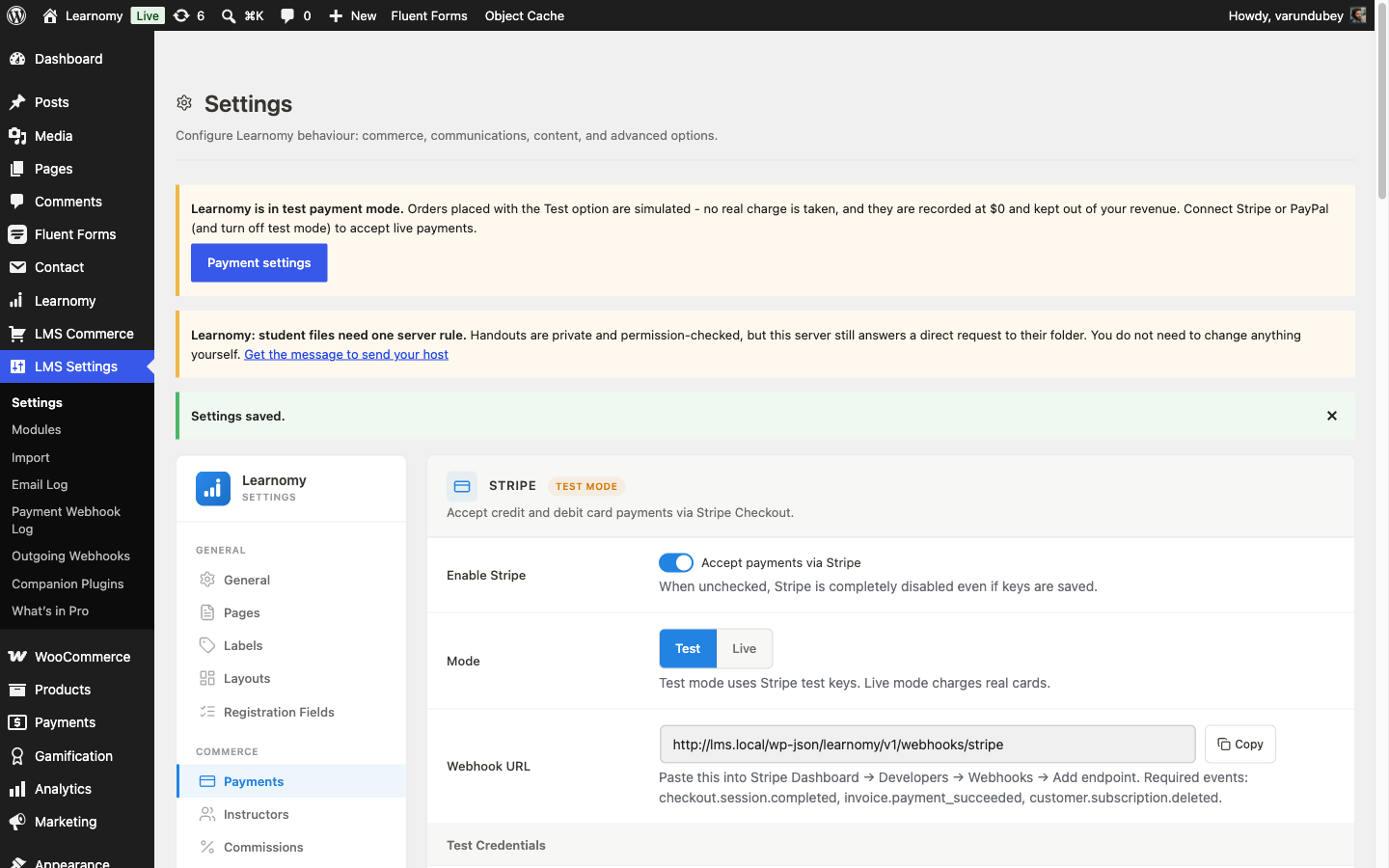 Stripe settings card, enabled, with the webhook URL and required events