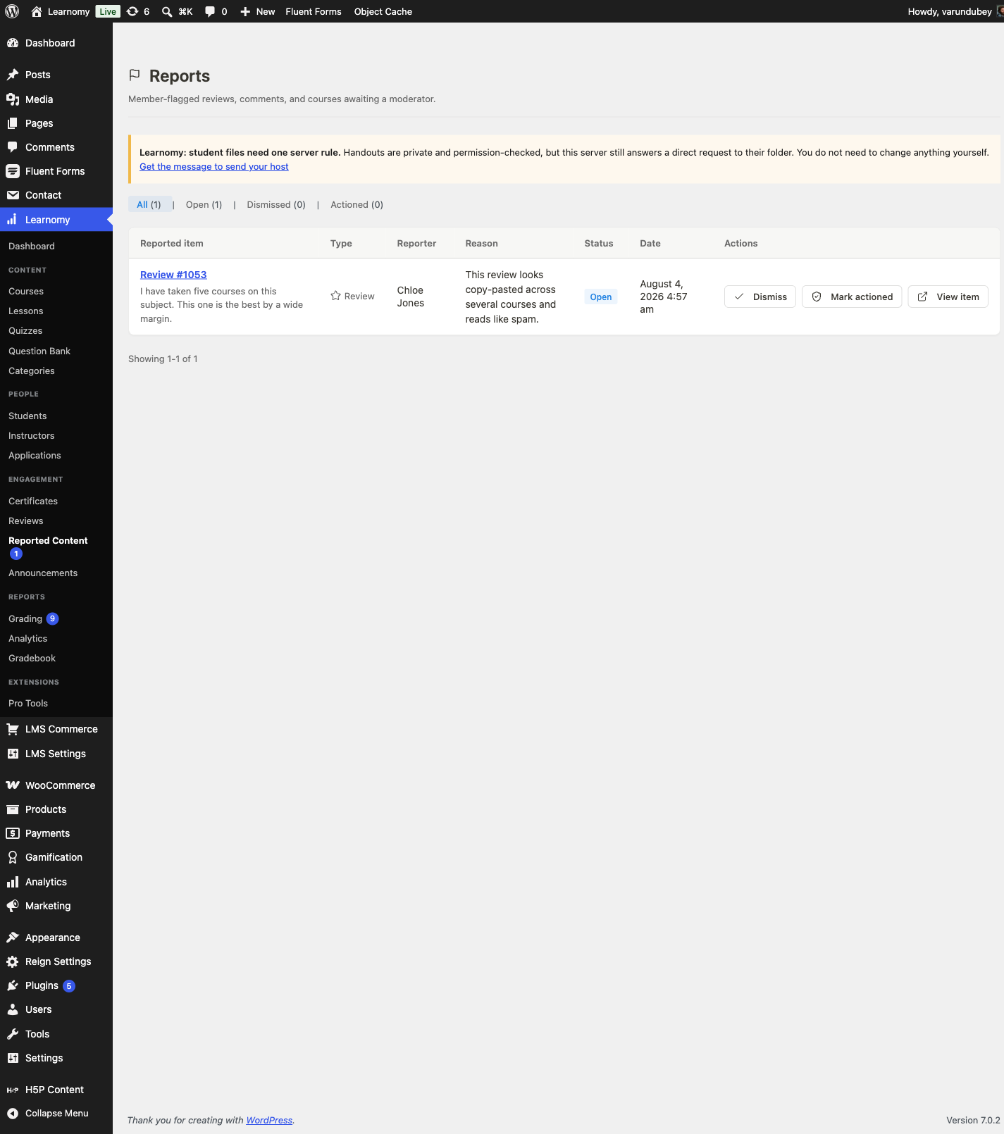 Reported Content queue with one open report against a course review