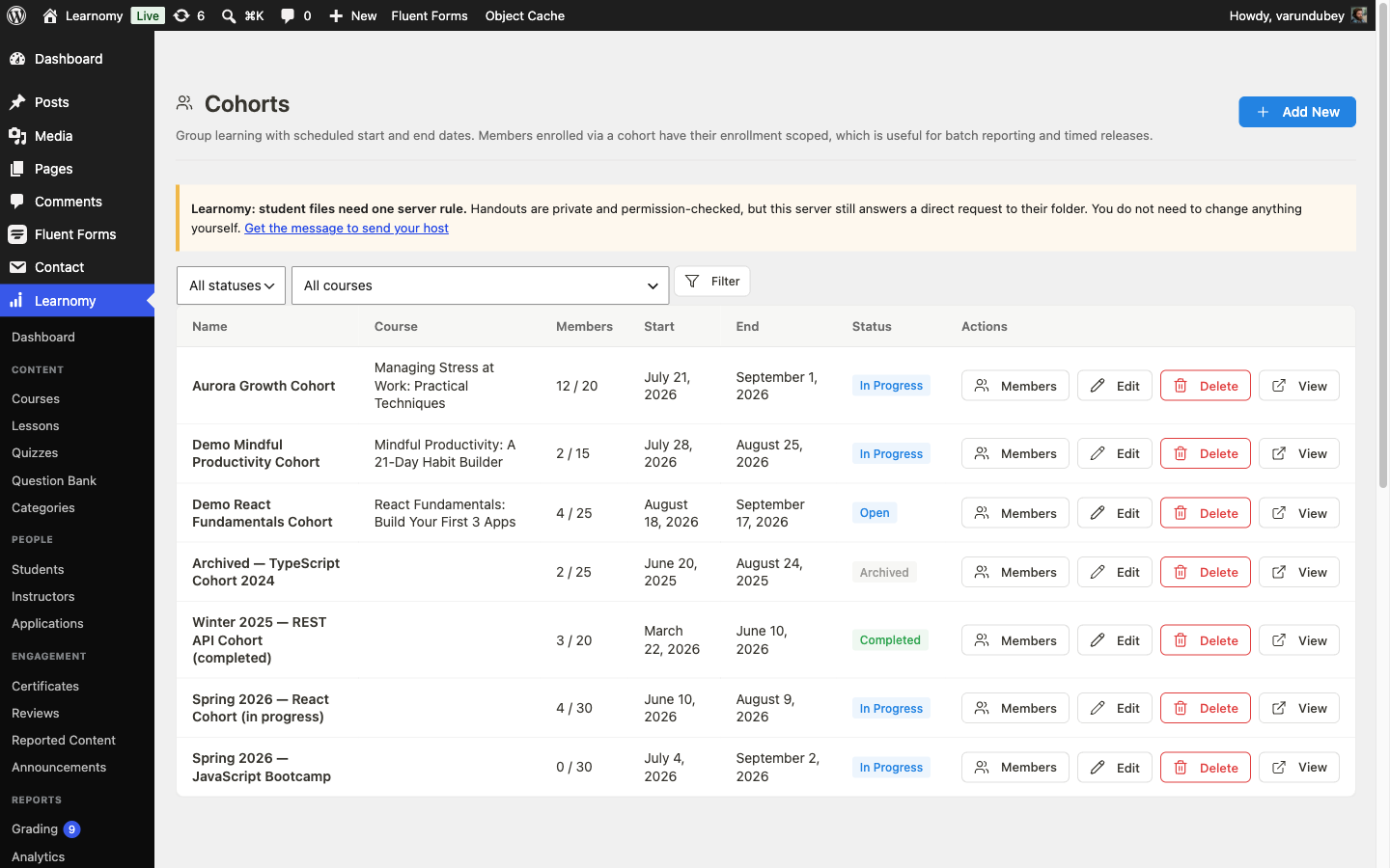 Cohorts list showing several batches at different statuses: In Progress, Open, Archived, and Completed